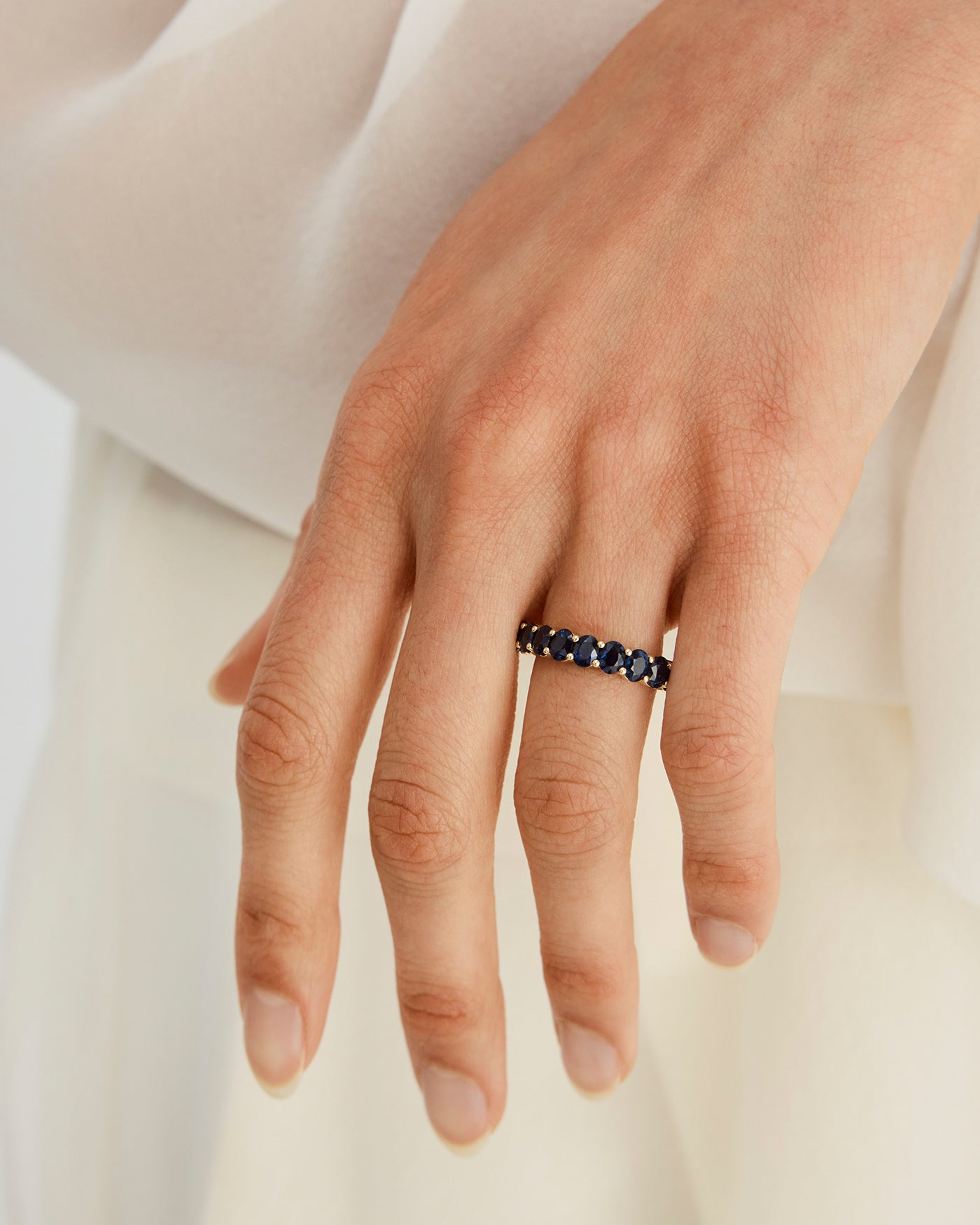 an image of a womans hand wearing the myra wrap ring