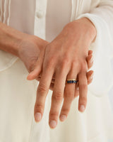 Woman wearing the macie wrap ring in sapphire