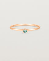 Front facing deep etched image of a rose gold ring with an alexandrite birthstone.