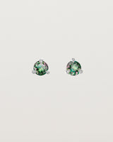 Front facing deep etched image of a pair of white gold earrings with an alexandrite birthstone.