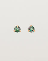 Front facing deep etched image of a pair of rose gold earrings with an alexandrite birthstone.