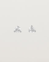 Front facing deep etched image of a pair of white gold earrings with a diamond birthstone.