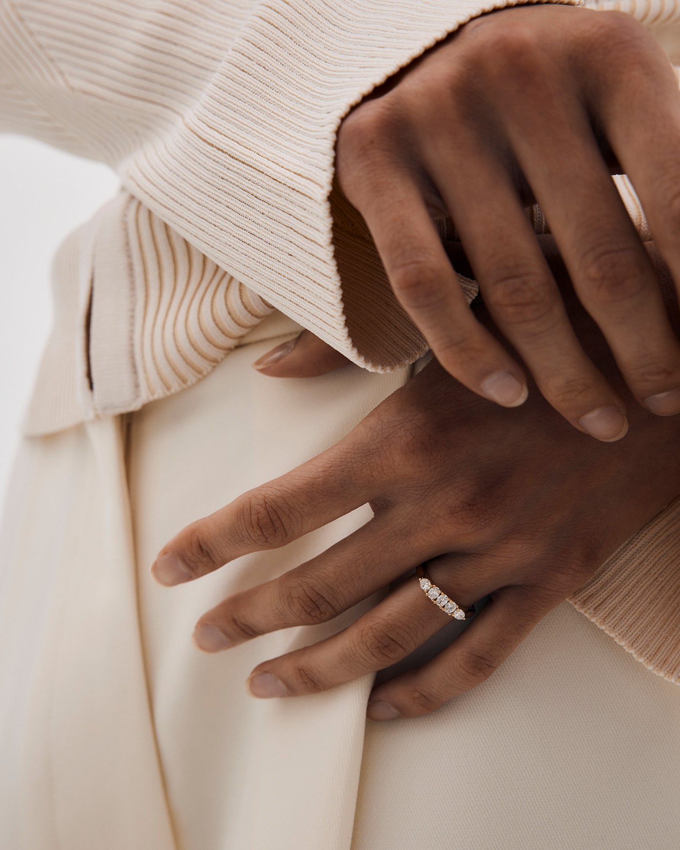 A woman wearing the Arlie Wrap Ring