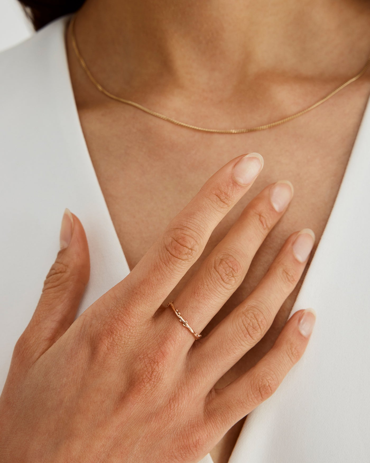 A woman wearing the Dotted Organic Stacking Ring