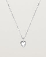 Pulled back image of a heart necklace in sterling silver