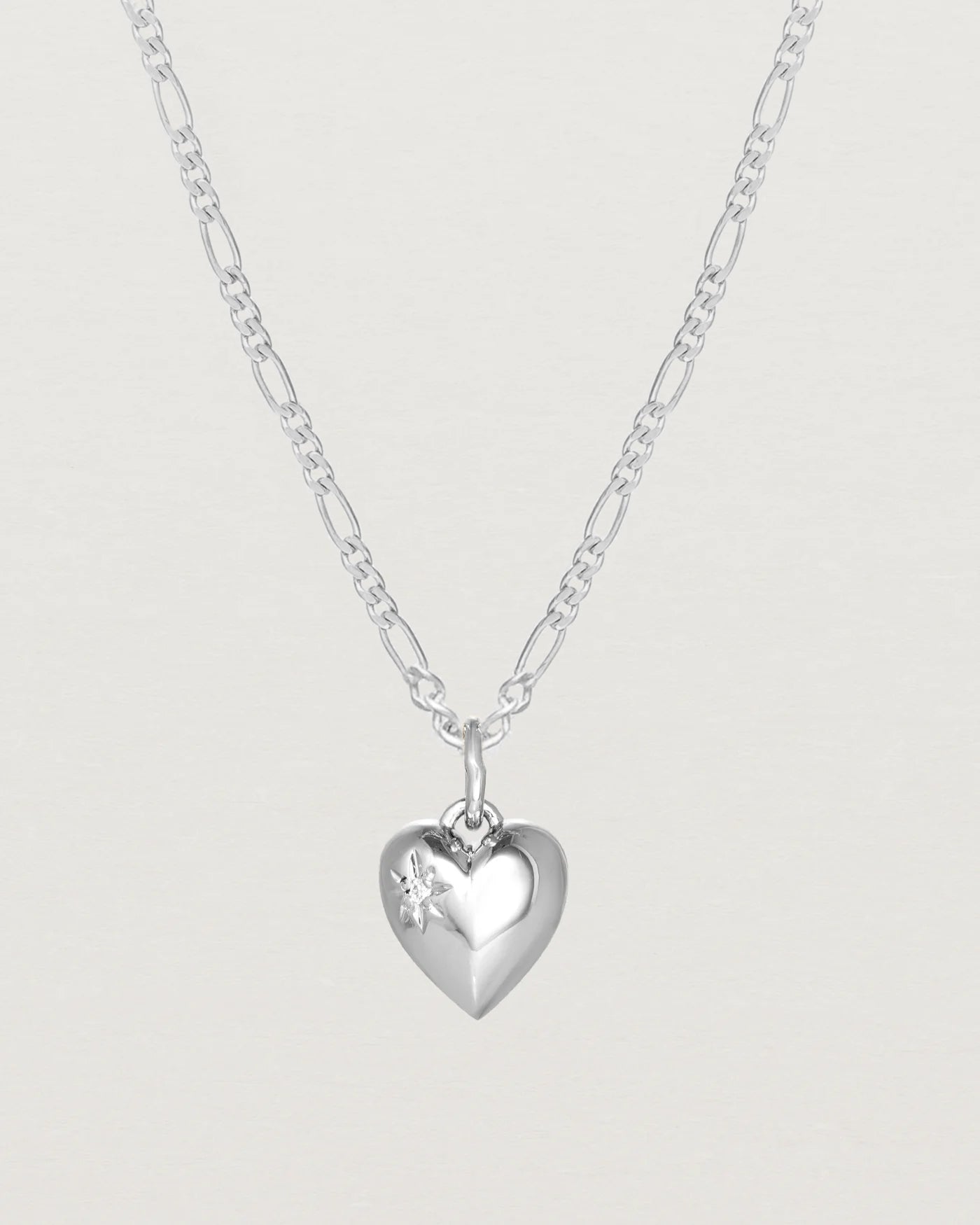 Close up image of a heart necklace in sterling silver.