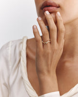 Model wears Ember Ring with Diamonds in yellow gold.