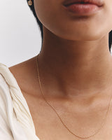 Model wears our Fancy Chain Necklace in yellow gold.