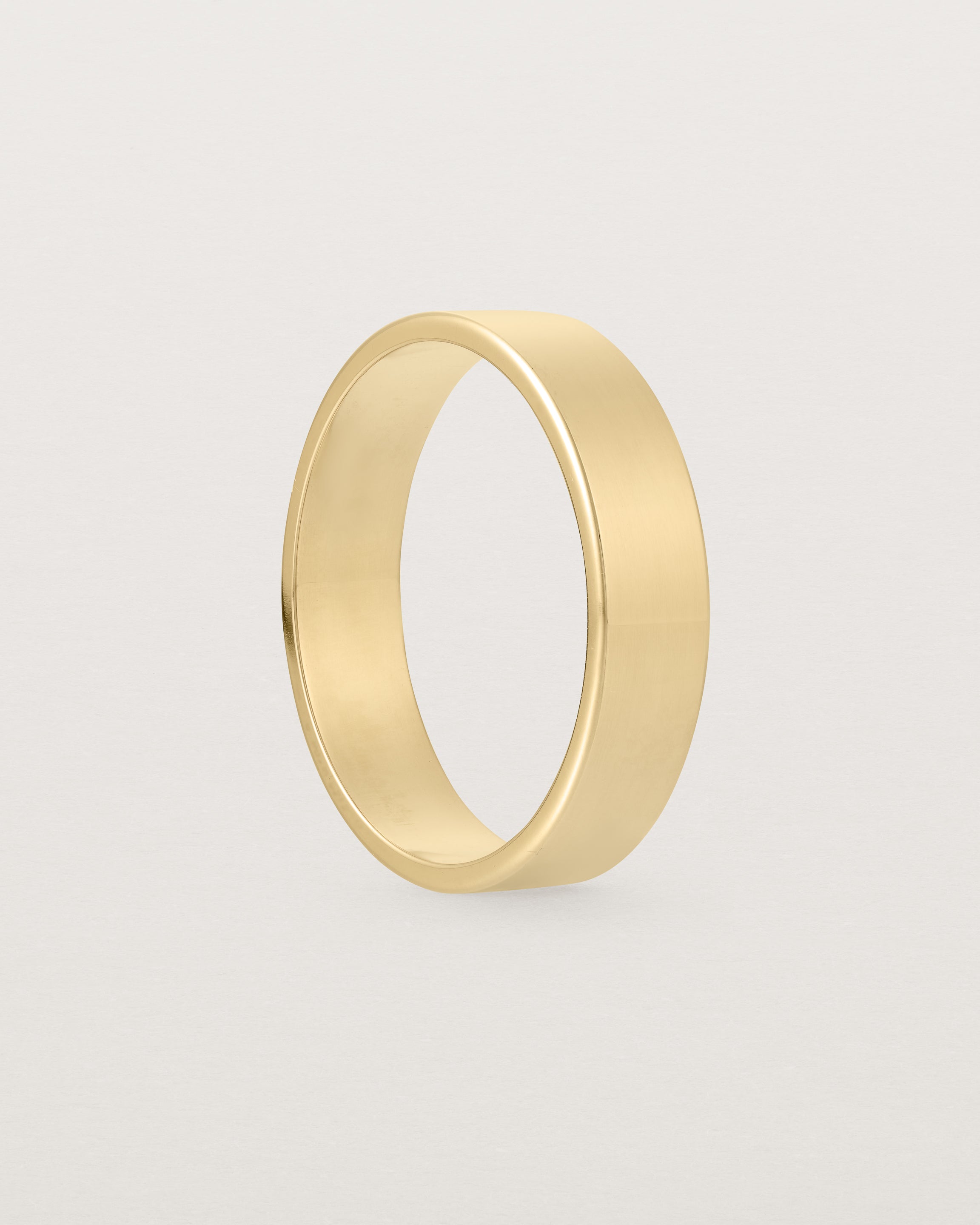 Gold ring with circle deals with line through it