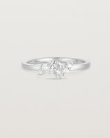 front on deep etched image of a white gold  engagement ring with a cluster of 7 white diamonds