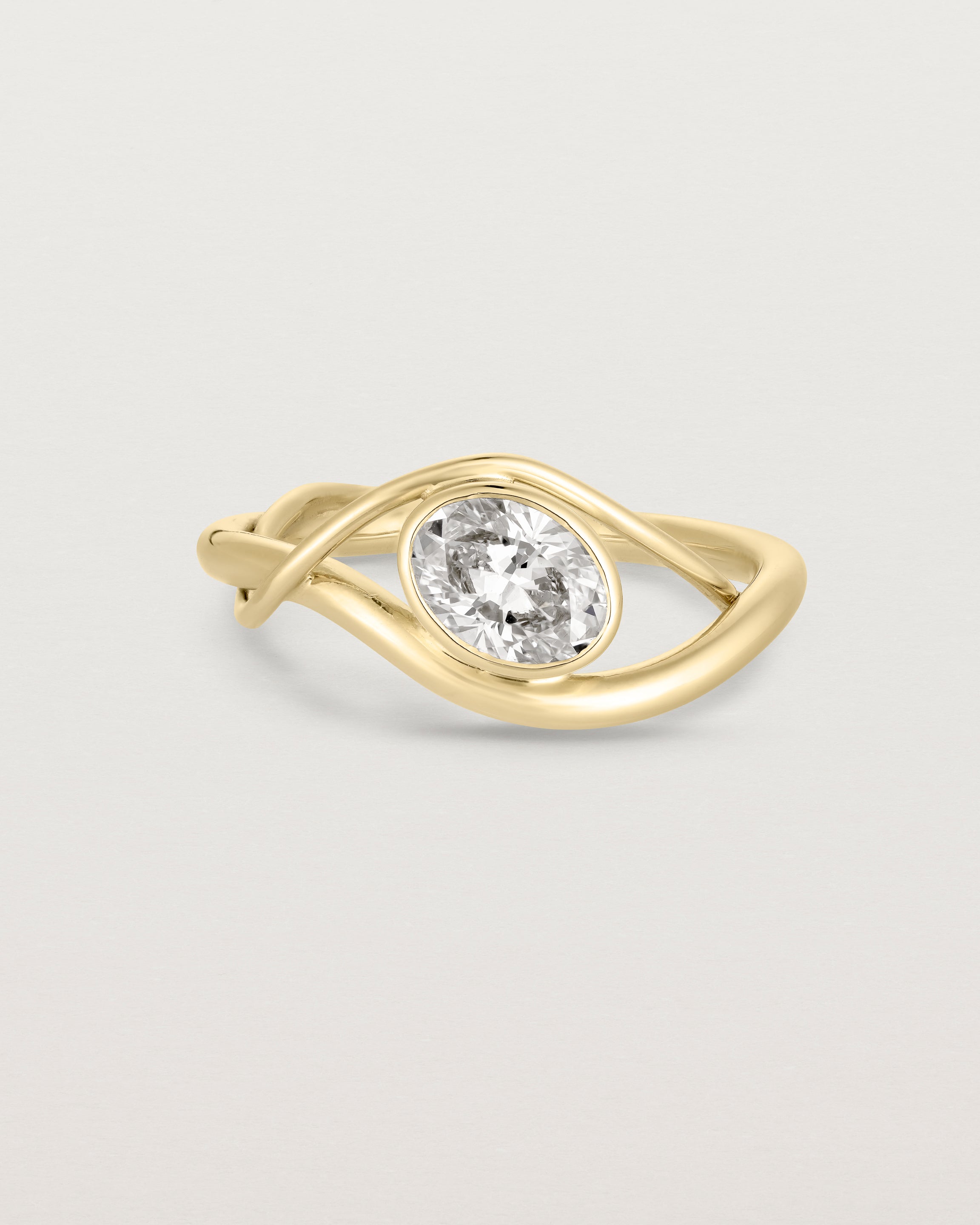 front on deep etched image of a yellow gold  engagement ring with a oval  diamond stone