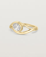 side on deep etched image of a yellow gold  engagement ring with a oval  diamond stone