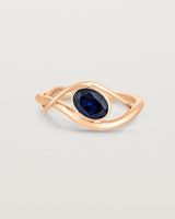 front on deep etched image of a rose gold  engagement ring with a oval  sapphire stone