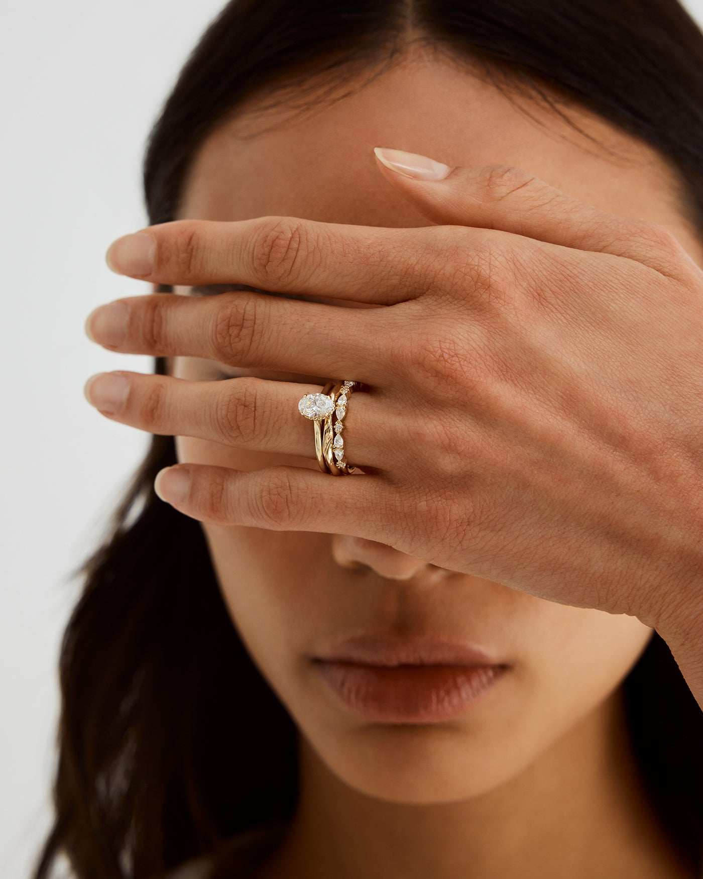 A woman wearing the Lena Ring in Diamonds stacked