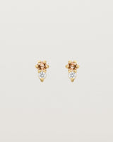 Front facing deep etched image of a pair of yellow gold earrings with citrine birthstones and diamonds.