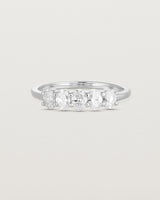 Front on deep etched image of a white gold wrap engagement ring with five oval diamonds.