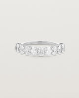 front on deep etched image of a white gold wrap engagement ring with 11 white diamonds.