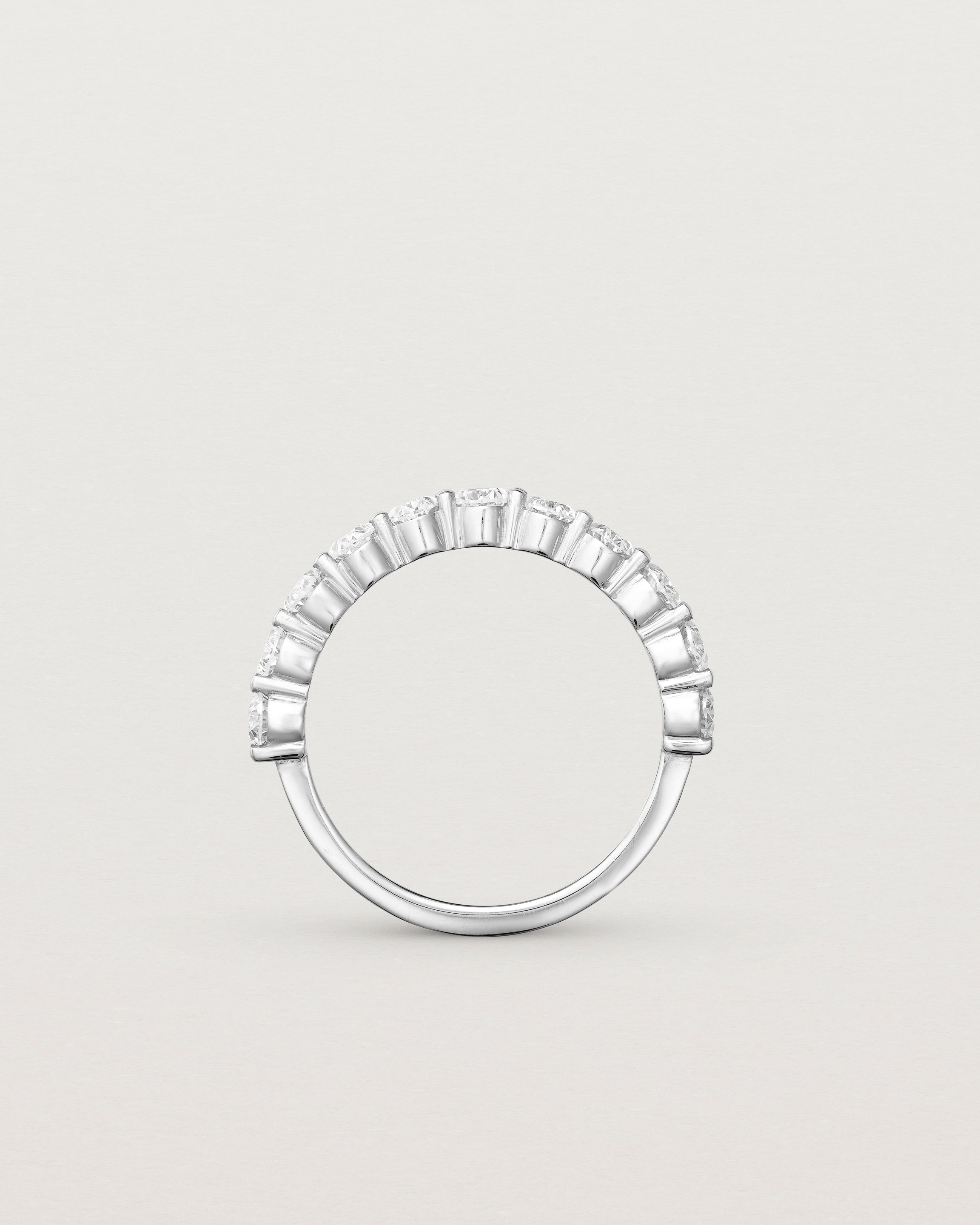 standing deep etched image of a white gold wrap engagement ring with 11 white laboratory grown diamonds.