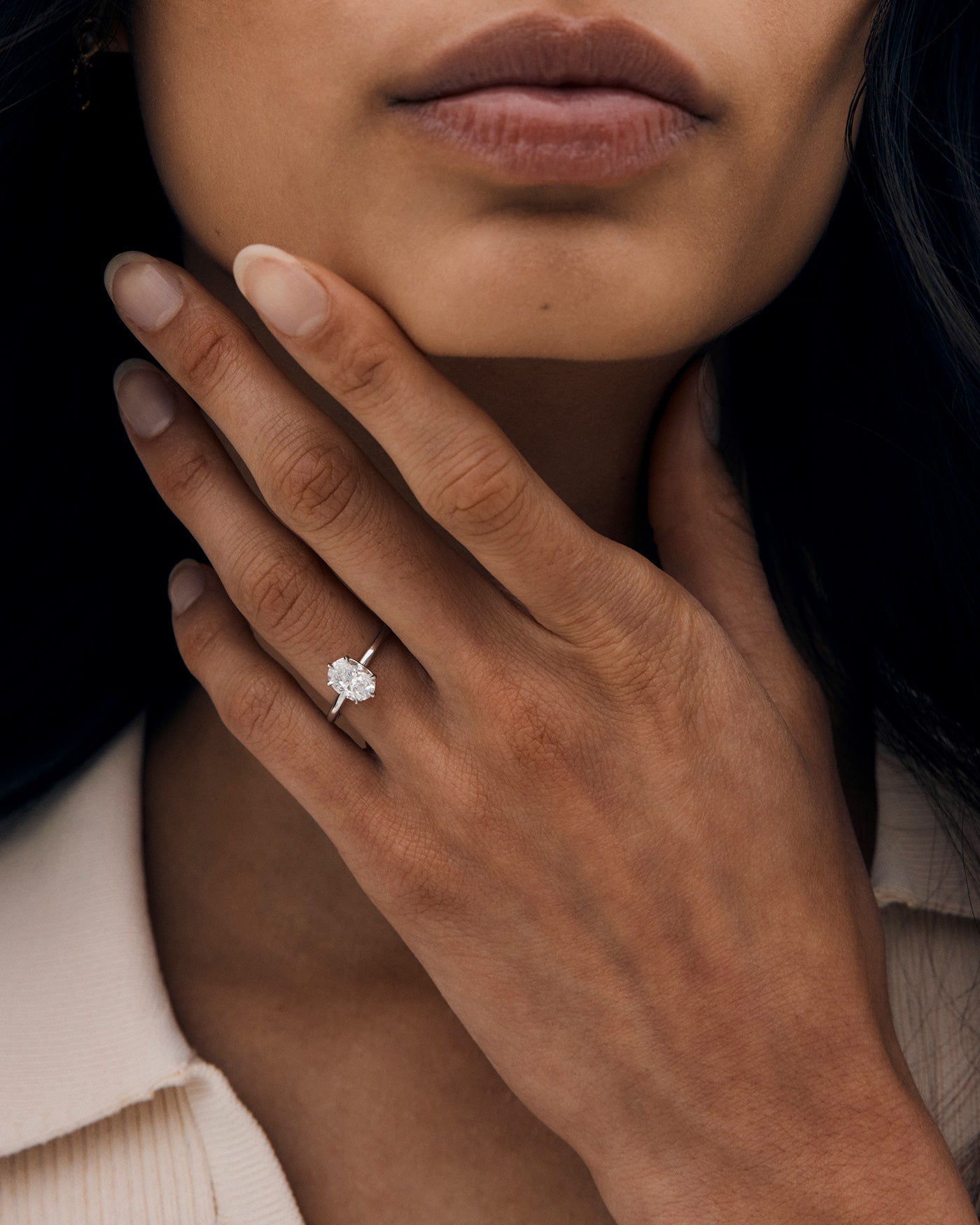 A woman wearing the No. 113 Signature Solitaire ring with a Laboratory Grown Diamond