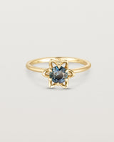 Front facing deep etched image of a Australian Teal Sapphire solitaire engagement ring. 