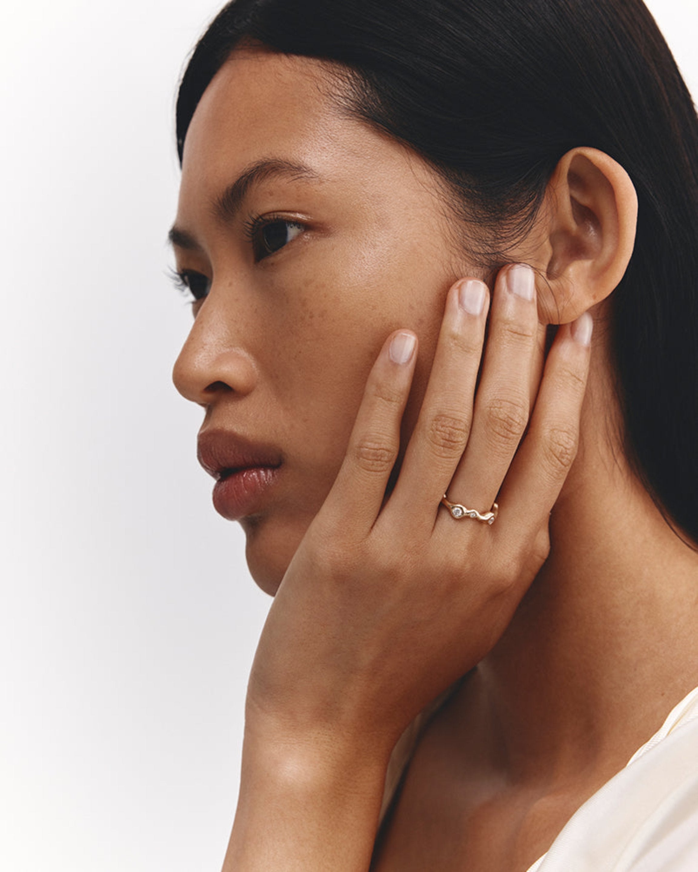 Model wears Organic Ring | Diamonds in yellow gold.