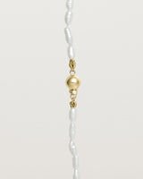 Deep etched image of the Sashi Pearl Necklace clasp detail in Yellow Gold