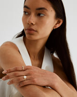 A woman wearing the Pearla Signet ring