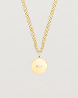 Close up image of the Petits Eily necklace with diamond in yellow gold