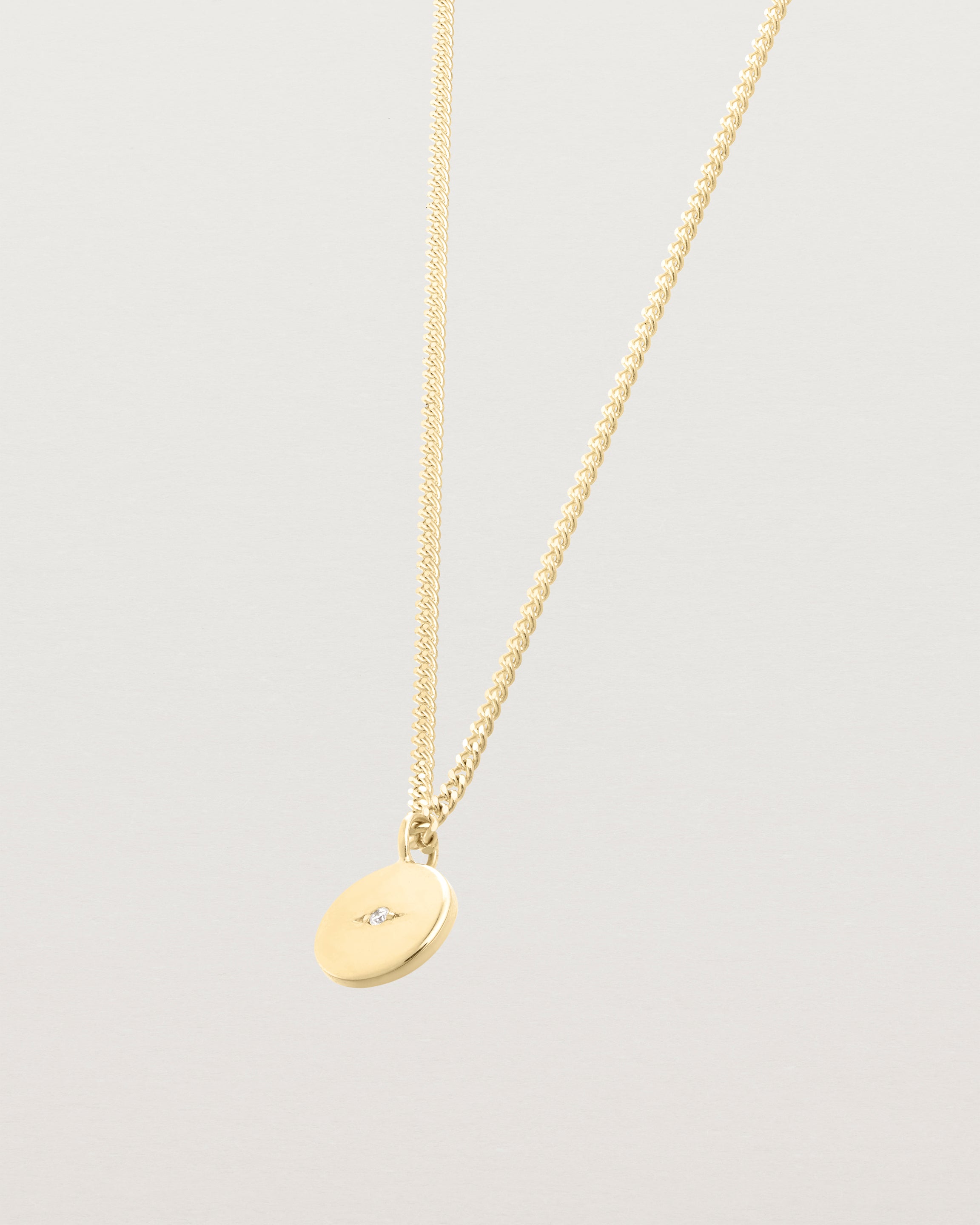 Side image of the Petits Eily necklace with diamond in yellow gold