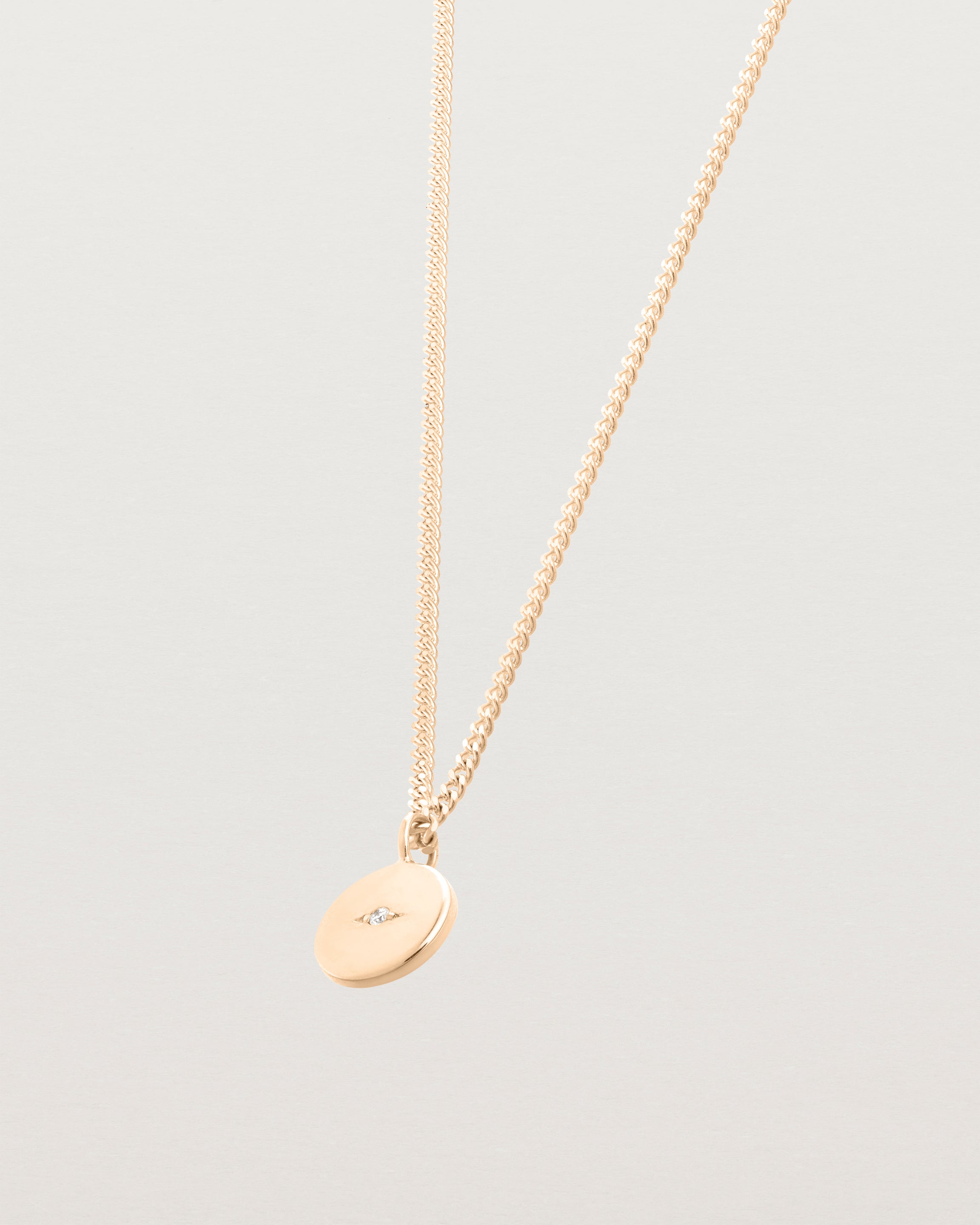 Side image of the Petit Eily Necklace in rose gold.