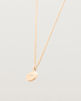 Side image of the Petit Eily Necklace in rose gold.