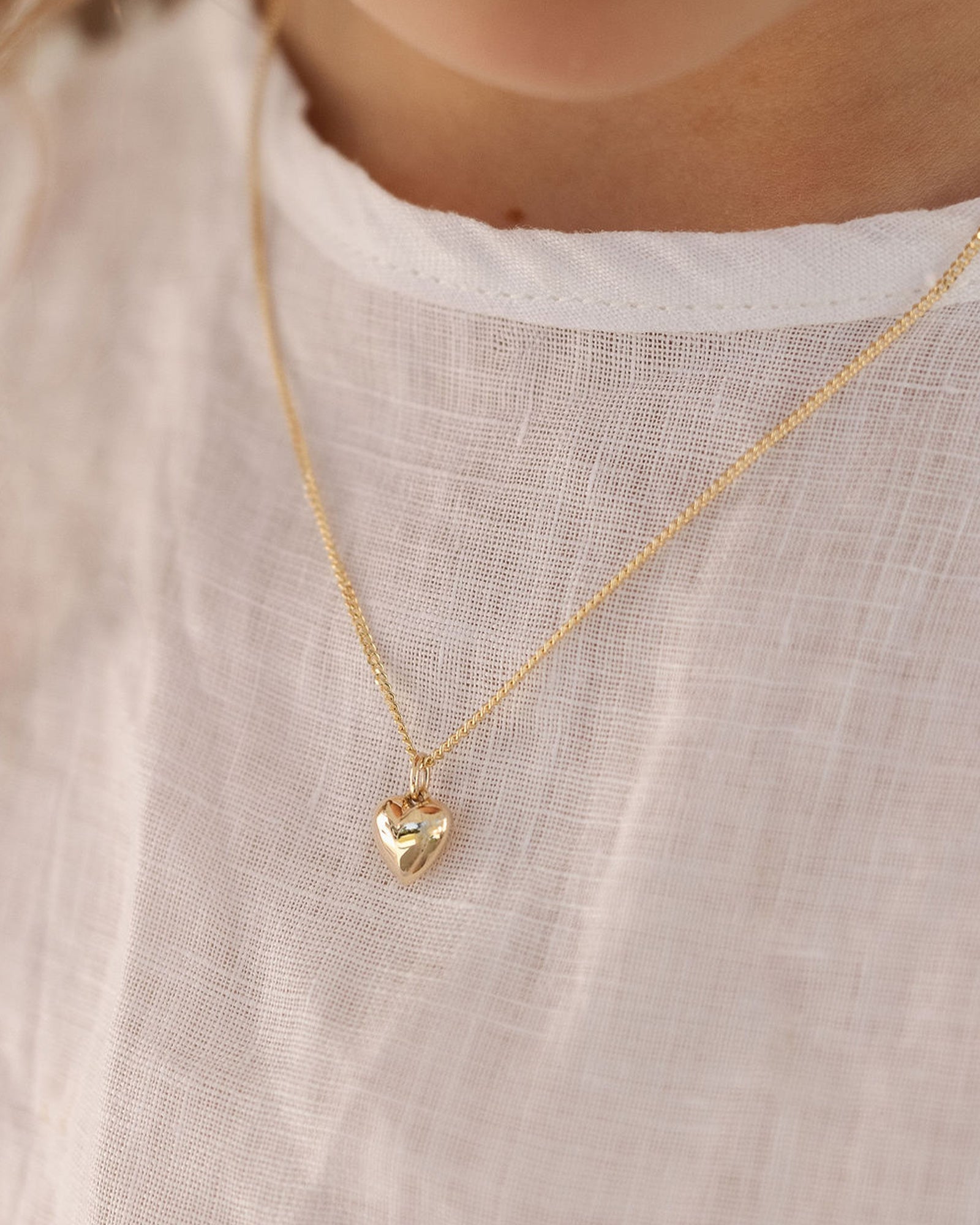 image of child wearing the Ella Necklace in yellow gold.