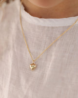 image of child wearing the Ella Necklace in yellow gold.