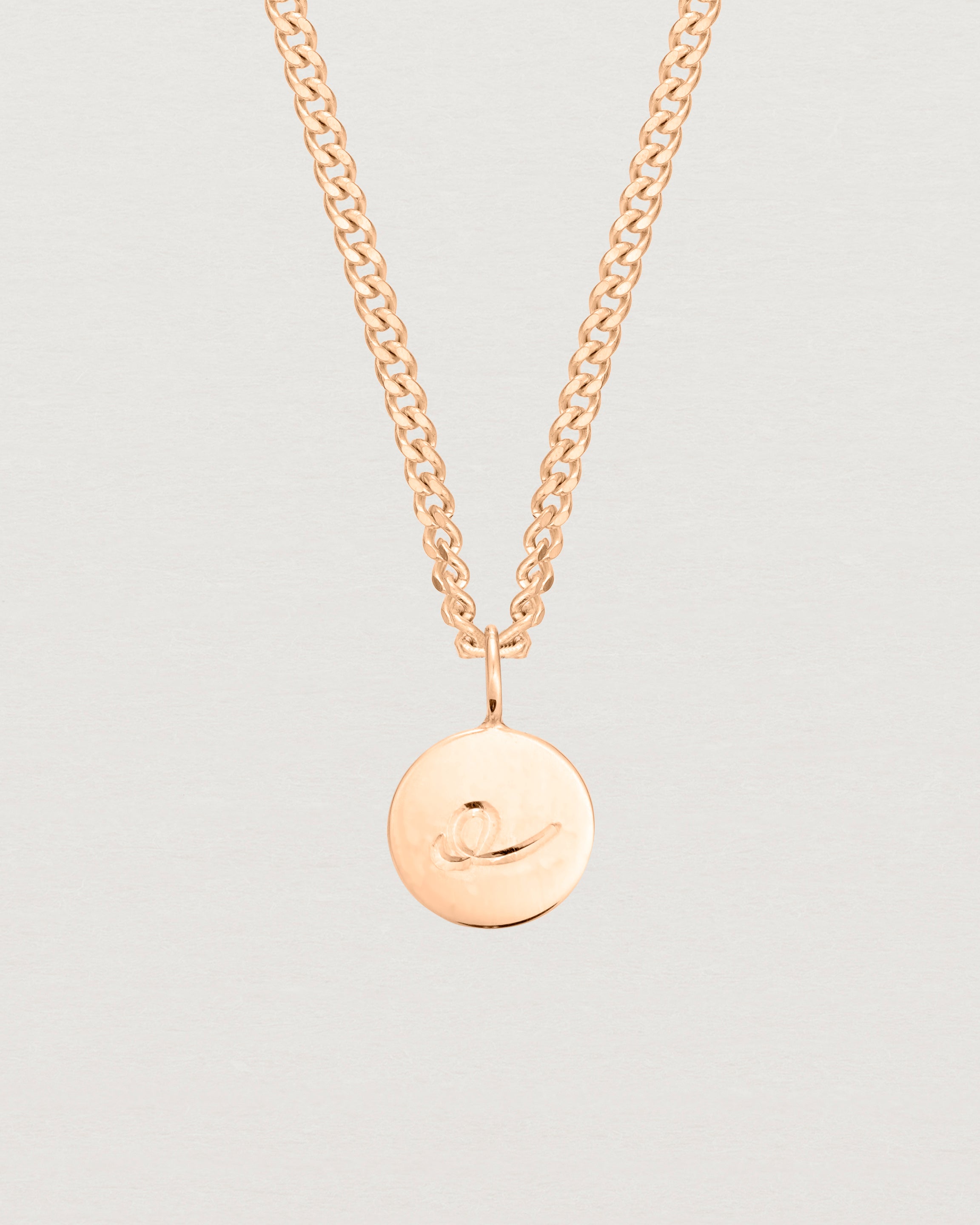 Close up image of the petits mae pendant in rose gold