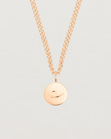 Close up image of the petits mae pendant in rose gold