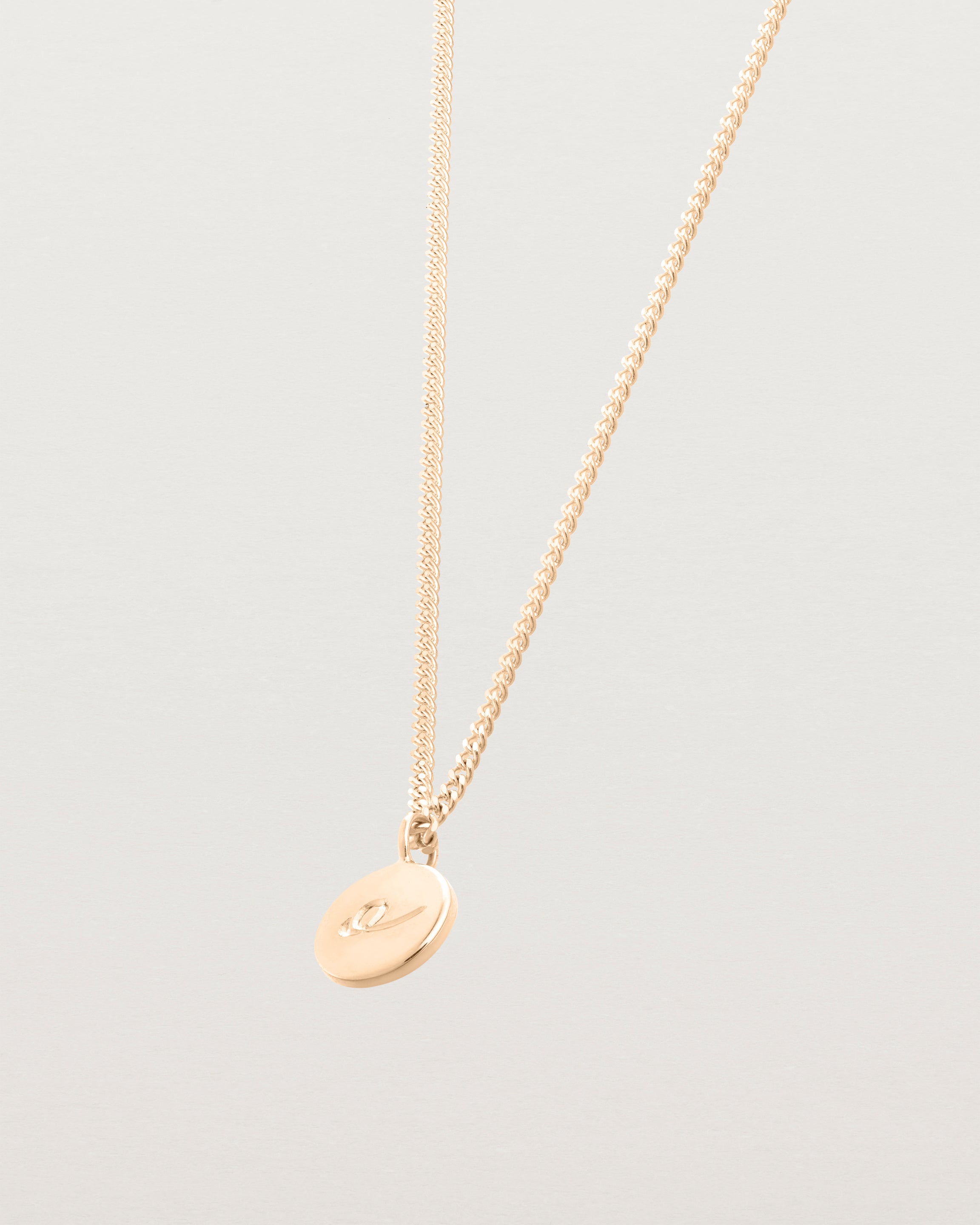 Side image of the petits mae pendant in rose gold