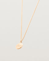 Side image of the petits mae pendant in rose gold