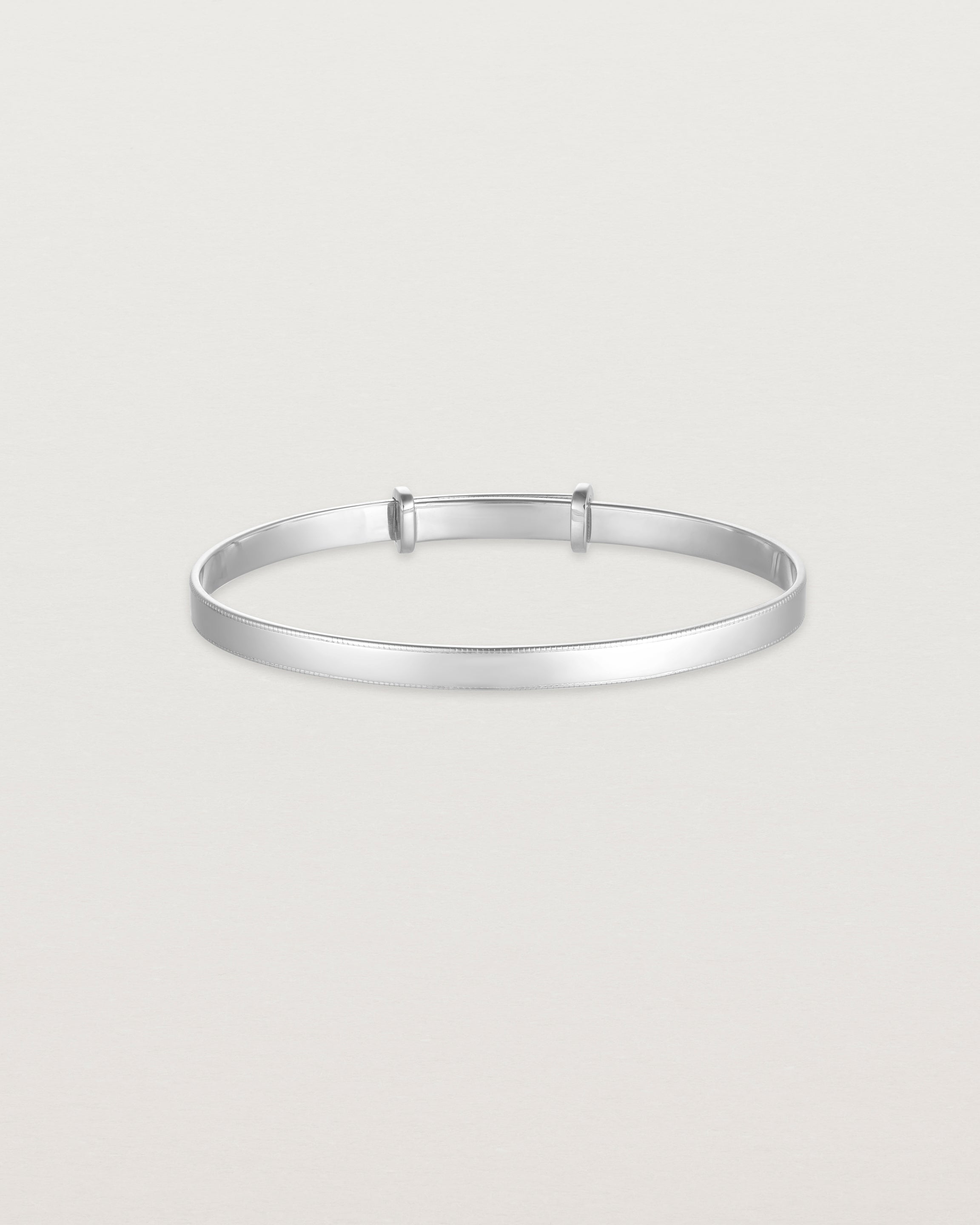 front image of the Toujours Bangle with millgrain in Sterling Silver