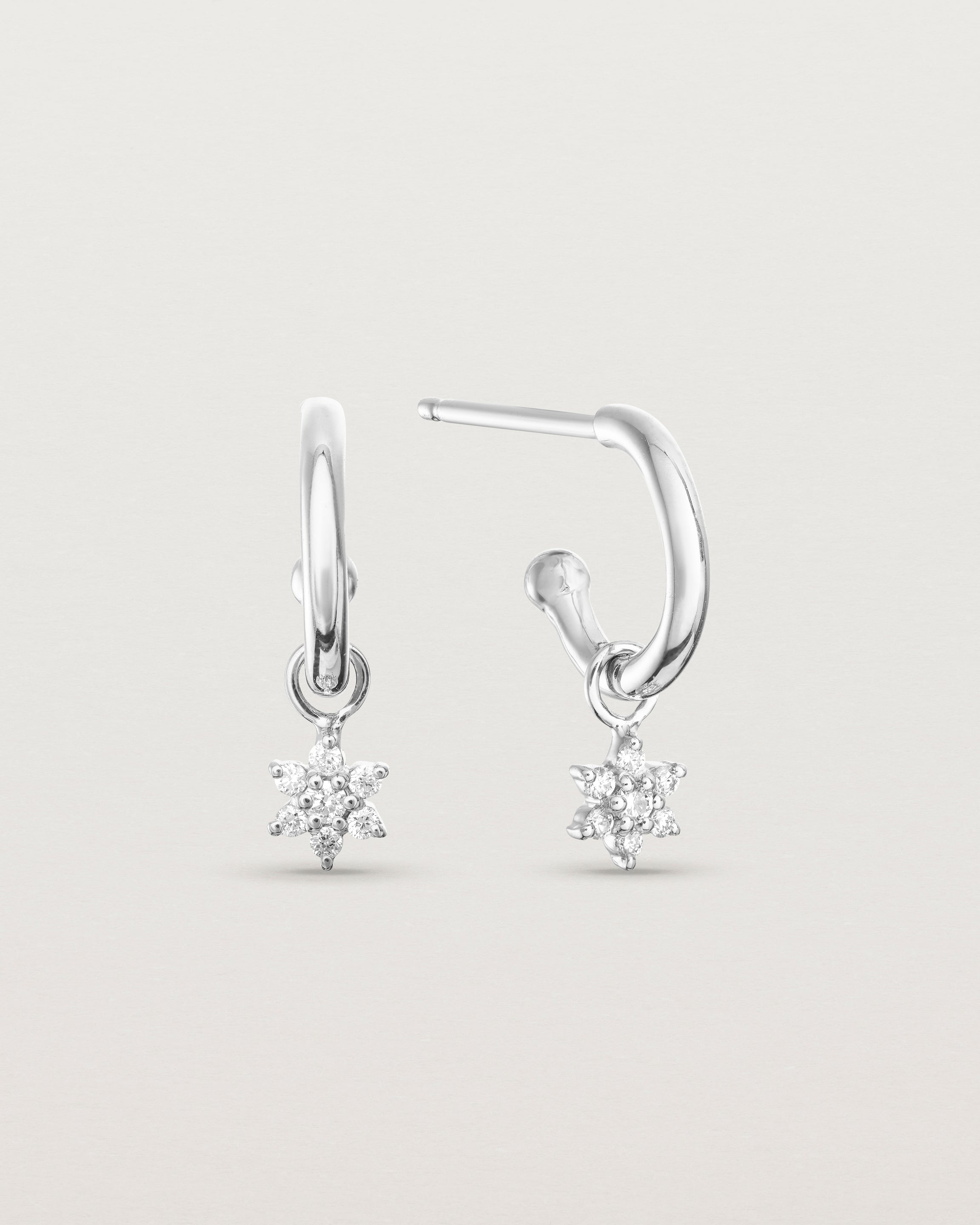 front on image of two petit starburst diamond hoops in white gold