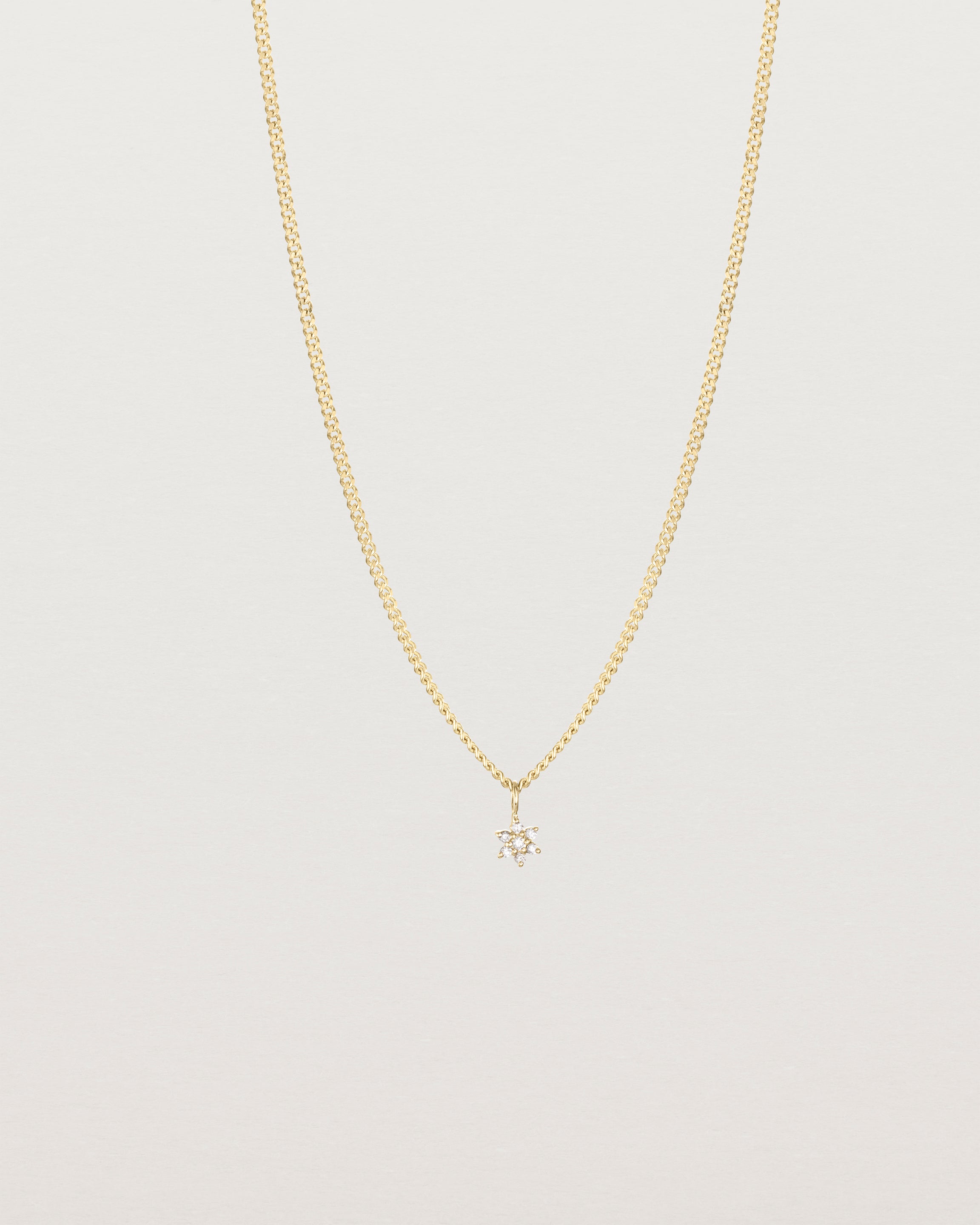 Front on image of the Starburst Diamond necklace in yellow gold