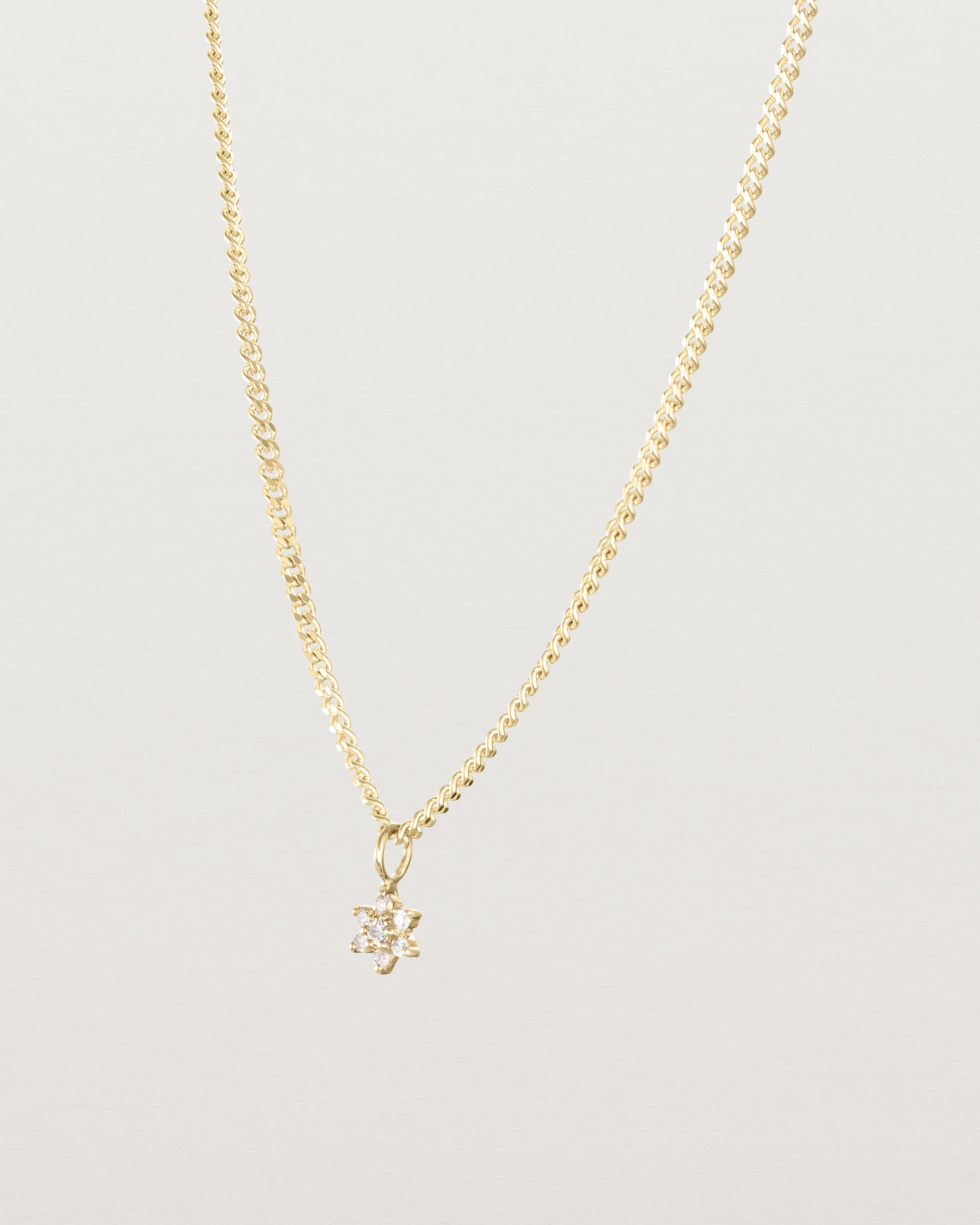 side on image of the Starburst Diamond necklace in yellow gold