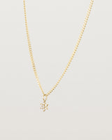 side on image of the Starburst Diamond necklace in yellow gold