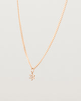 Side image of the petits starburst diamond necklace in rose gold.