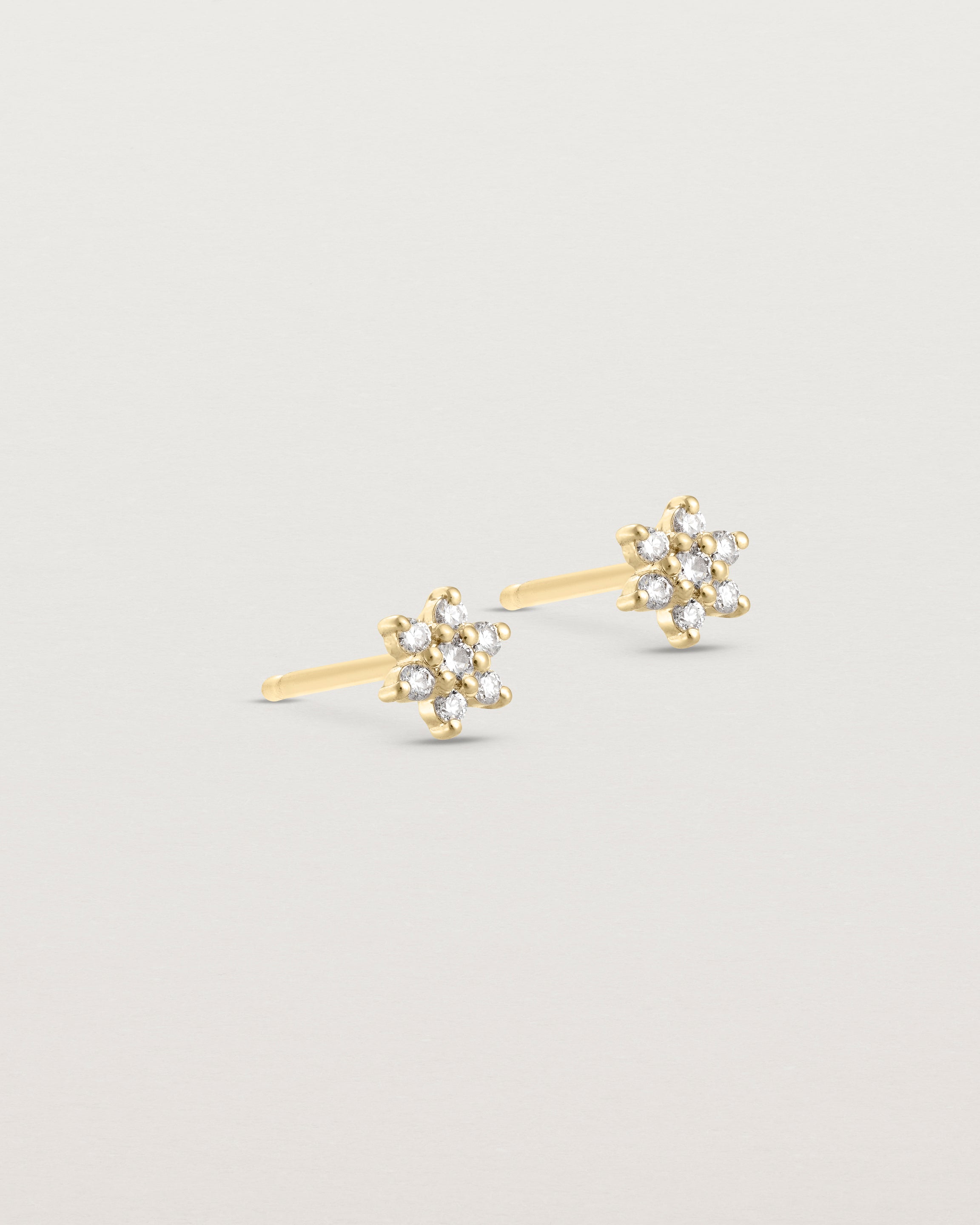 Side image of the petit starburst studs with white diamonds