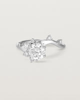 front on deep etched image of a white gold  engagement ring with a cluster of laboratory grow diamonds