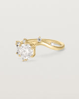 side facing deep etched image of a yellow gold  engagement ring with a cluster of laboratory grow diamonds