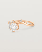 side facing deep etched image of a rose gold  engagement ring with a cluster of laboratory grow diamonds