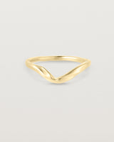 Front facing deep etched image of a yellow gold wedding band