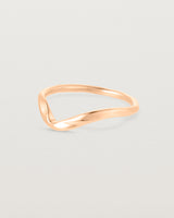 Side facing deep etched rose gold wedding band