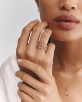 Model wear Rumi Ring and Rumi Diamond Ring stacked in yellow gold.